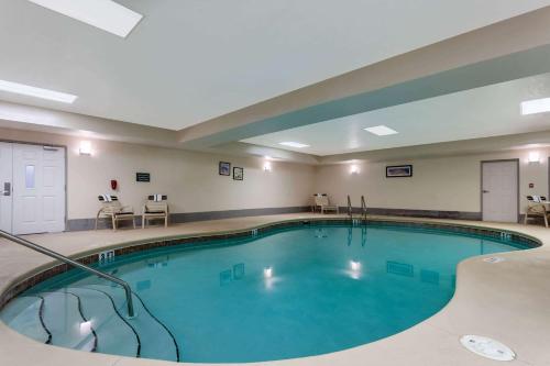 a large swimming pool in a hotel room at La Quinta by Wyndham Port Orange / Daytona in Port Orange