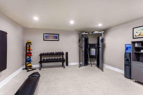 a fitness room with a gym with weights at La Quinta by Wyndham Port Orange / Daytona in Port Orange