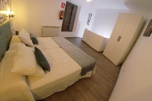 a hotel room with two beds in a room at RCBCALEROS in Cáceres