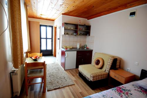 a room with a kitchen and a living room at Apartments Jeca in Zlatibor