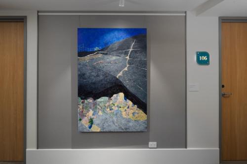 a painting in a wall in a building at Crystalbrook Bailey in Cairns