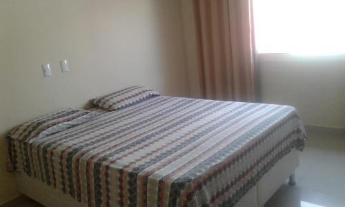 Lova arba lovos apgyvendinimo įstaigoje Conforto e Comodidade Porto Seguro BA