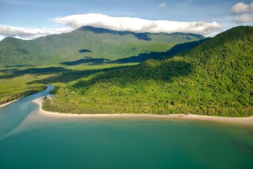 an aerial view of a beach and the ocean at Thornton Beach Bungalows Daintree in Cape Tribulation