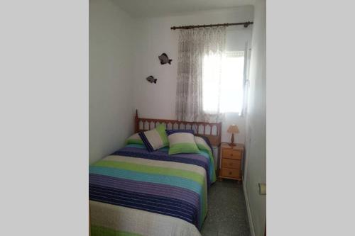 A bed or beds in a room at Casa a pie de playa en Las Marinas