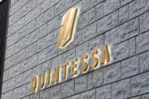 a sign on the side of a building at Quintessa Hotel Tokyo Ginza in Tokyo