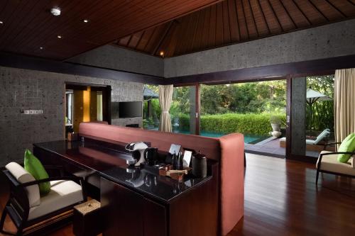 a kitchen with a counter with a coffee maker on it at Sanctoo Suites & Villas in Sukawati