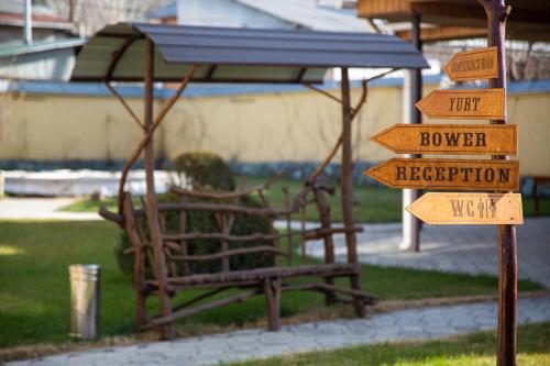 a bunch of street signs in a park at Ethno boutique Hotel Osh in Osh