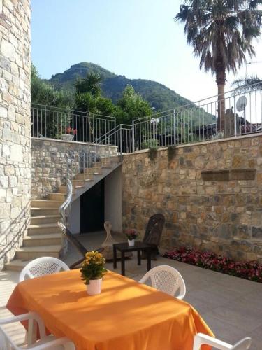 a table and chairs sitting on a patio at Villa Le Favole in Sant'Egidio del Monte Albino