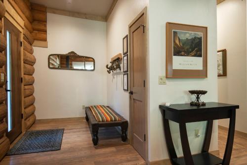 a hallway with a bench next to a door at 38 The Mini Cabin in Wawona