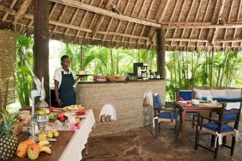 
A restaurant or other place to eat at Diani Marine Divers Village
