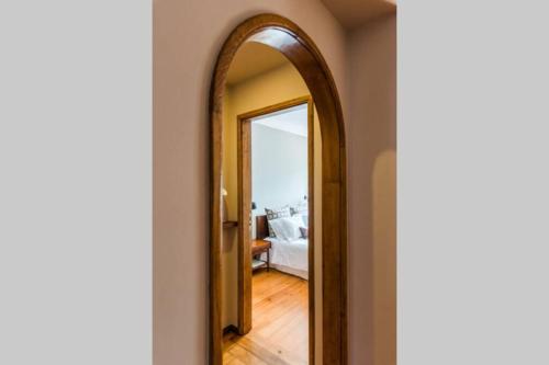 a hallway with a mirror in a room at GuestReady - Rivoli Studio in Porto