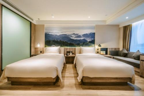 Giường trong phòng chung tại Atour Hotel Changsha Lugu Branch