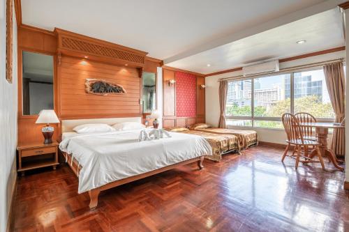 Ένα ή περισσότερα κρεβάτια σε δωμάτιο στο Royal Ivory Sukhumvit Nana
