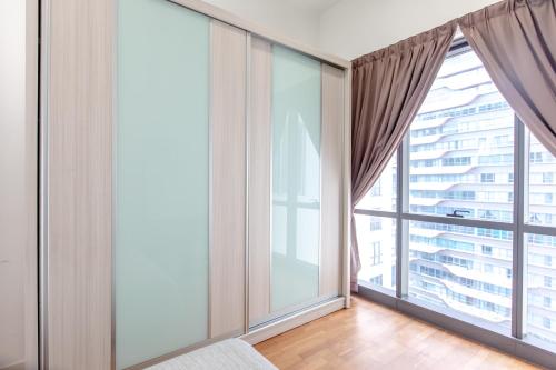 a living room with large windows and a large window treatment at Rex Ollie @ The Elements Ampang in Kuala Lumpur