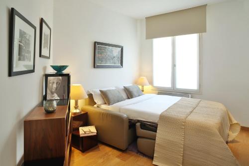 Ένα ή περισσότερα κρεβάτια σε δωμάτιο στο Montmartre Residence