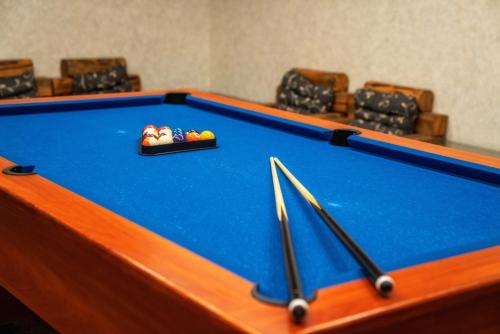 a pool table with balls in a bowl on it at Hotel Eco Tatry Holiday& Spa in Kościelisko