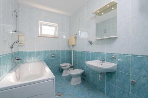Kúpeľňa v ubytovaní Apartmani Dubravko