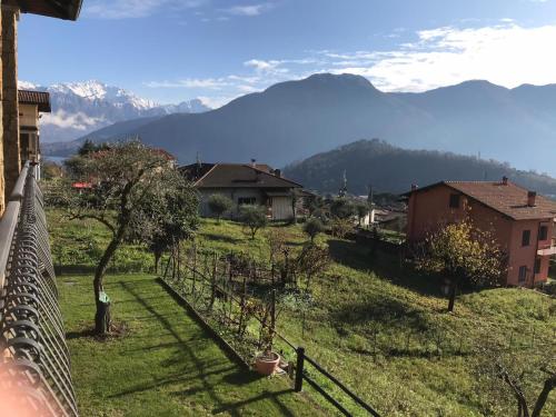 a view of a village with mountains in the background at Villa The Princess in Lenno
