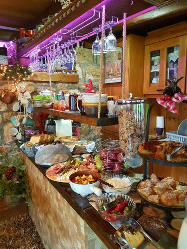 a buffet line with many different types of food at Μαγεμένο Βουνό in Karpenision