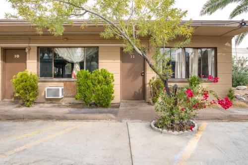 a house with flowers in front of it at OYO Oasis Motel Las Vegas I-15 in Las Vegas