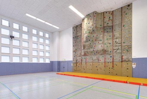 a gym with a climbing wall and a bouldering wall at Sportpark Rabenberg in Breitenbrunn