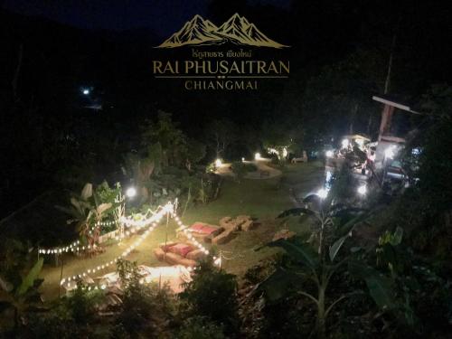 a view of a park at night with lights at Rai Phusaitran ไร่ภูสายธาร in Mae Taeng