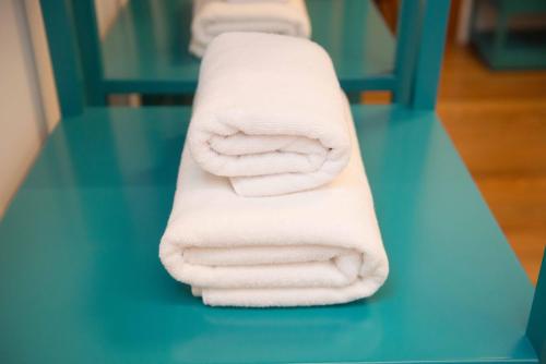 a stack of towels sitting on top of a table at Jacío House in Moya