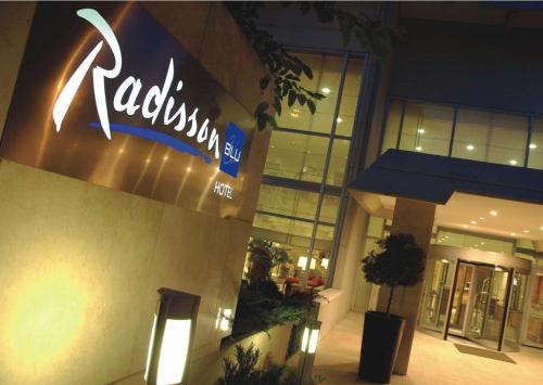 a restaurant sign on the side of a building at Radisson Blu Ankara in Ankara