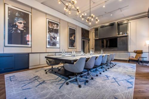 a conference room with a long table and chairs at Radisson Blu Hotel Prague in Prague