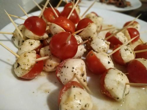 a plate of food with tomatoes and cheese at Na Losenici in Nicov