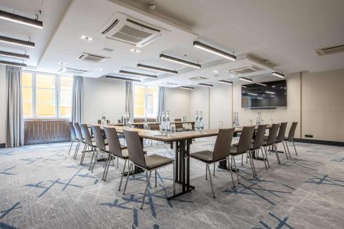 a conference room with a long table and chairs at Radisson Blu Hotel Prague in Prague