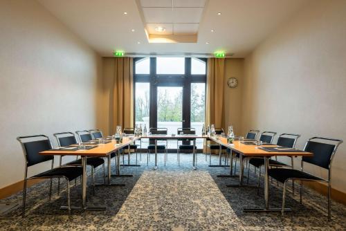 a conference room with a long table and chairs at Radisson Blu Hotel Paris, Marne-la-Vallée in Magny-le-Hongre