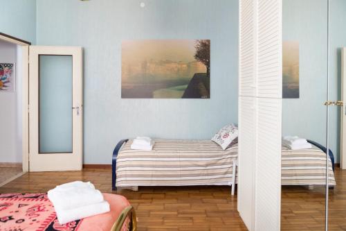 En eller flere senge i et værelse på Parma A due passi dal Duomo Apartment