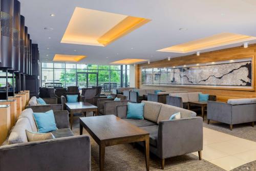 a waiting room with couches and chairs and tables at Radisson Blu Hotel, Athlone in Athlone