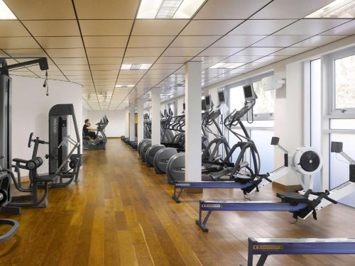 a gym with rows of treadmills and exercise bikes at Radisson Blu Hotel, Cork in Cork