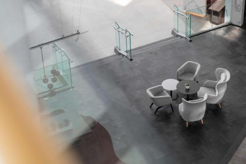 an overhead view of a meeting room with a table and chairs at Radisson Blu Hotel London Stansted Airport in Stansted Mountfitchet