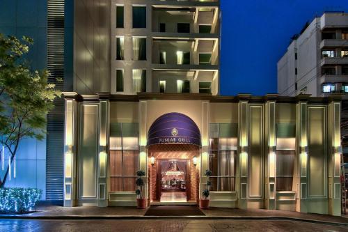 a hotel building with a doorway leading into a building at Radisson Suites Bangkok Sukhumvit in Bangkok