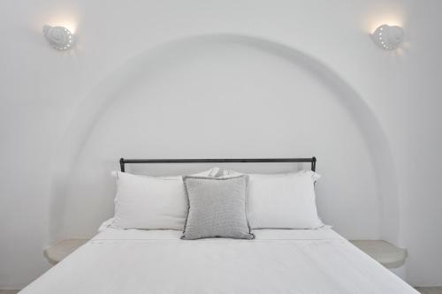 a white bed with white sheets and pillows at Dunes Apartment Part Of White Dunes Luxury Boutique Hotel in Santa Maria