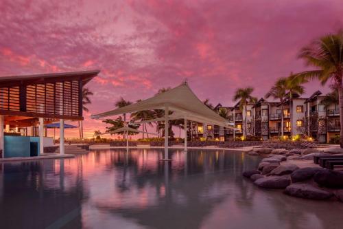 a large body of water with palm trees at Radisson Blu Resort Fiji in Denarau
