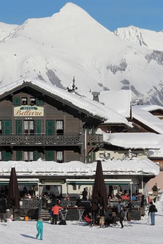 a ski lodge with snow on the roof of it at Bellevue in Les Gets