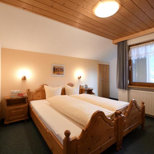 Postel nebo postele na pokoji v ubytování Rüf Wohlfühl-Apartments