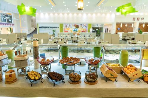 a buffet of food on a table in a store at Radisson Blu Resort Jizan in Jazan