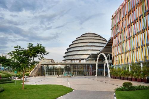 a large building with a domed roof with a courtyard at Radisson Blu Hotel & Convention Centre Kigali in Kigali