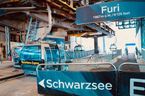 a train is being constructed in a train station at Haus Fleckstein Zermatt Wohnung Karibu in Zermatt