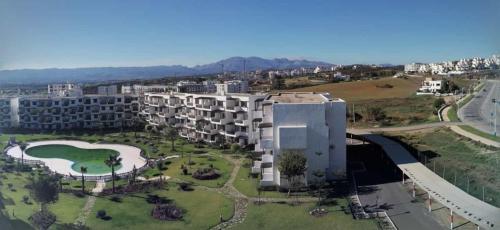 an aerial view of a building in a city at Studio avec piscine à Mirador cabo négro in Cabo Negro