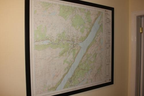 a framed map hanging on a wall at Loch Ness Balcony Apartment in Drumnadrochit
