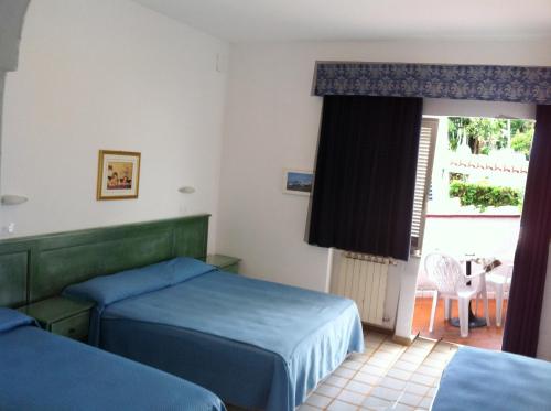 Postel nebo postele na pokoji v ubytování Hotel Castiglione