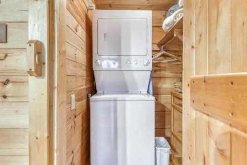 a refrigerator in the corner of a tiny house at Pine Cone Ridge in Sevierville