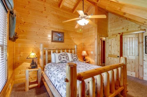 a bedroom with a bed in a log cabin at Tennessee Treasure in Pigeon Forge