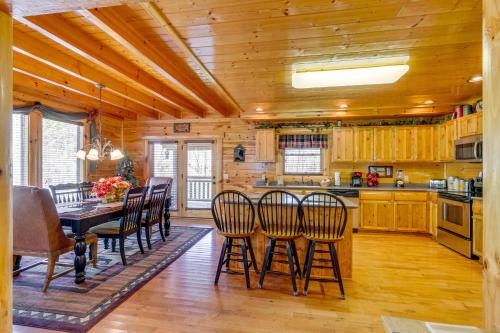 a dining room with a table and chairs at Tennessee Treasure in Pigeon Forge